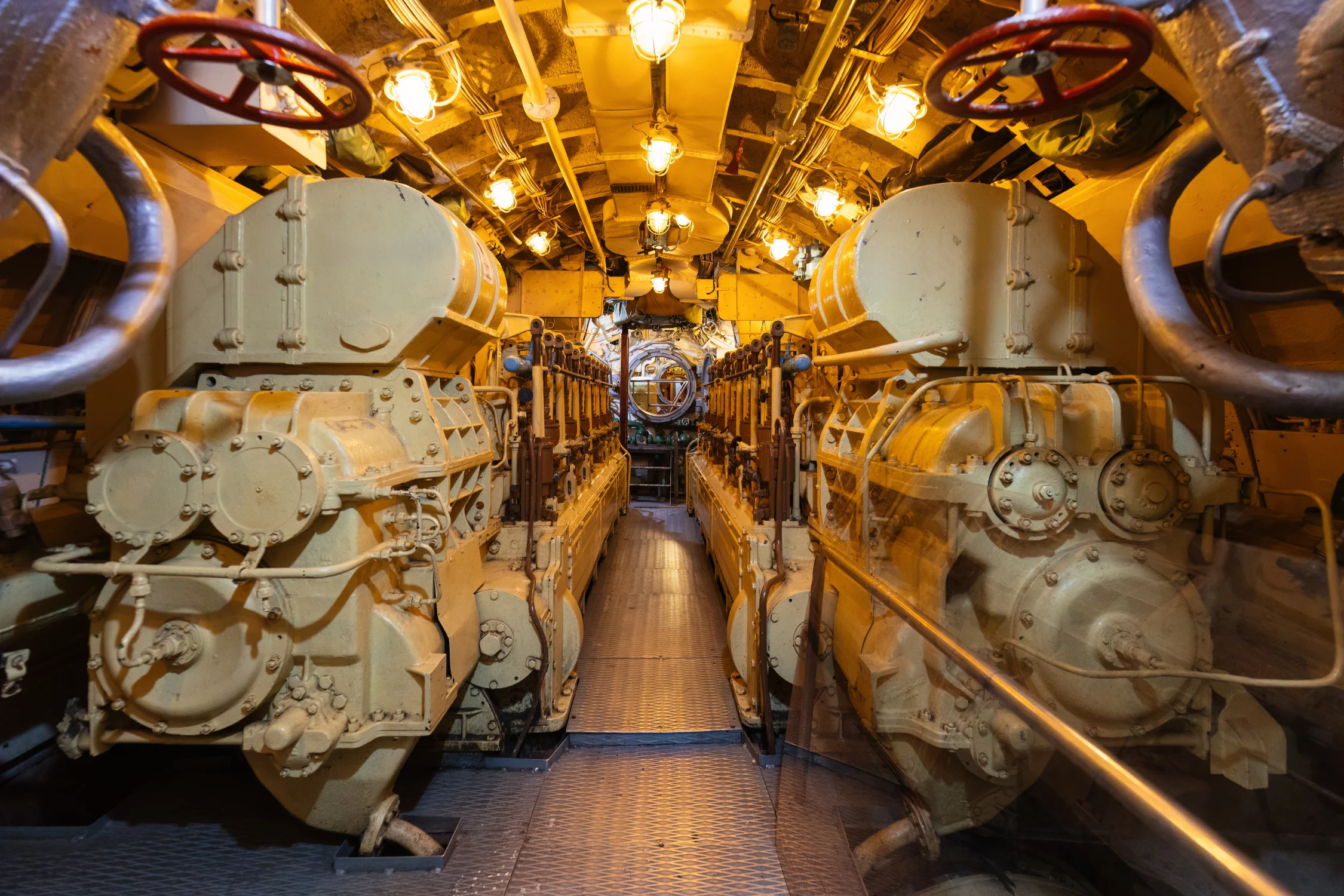 Interior of diesel military submarine showing installed engine and machinery