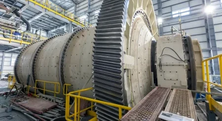 Industrial ball mill grinder in a mining and heavy industry processing facility